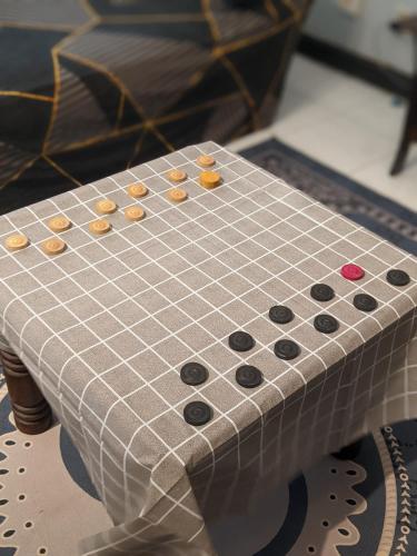 a checker board sitting on top of a table at Homestay D'Lapang near KLIA in Sepang