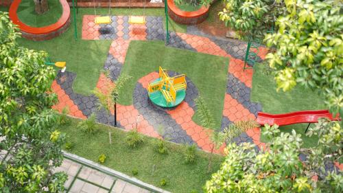 an overhead view of a garden with a table and chairs at Mesteria Inn Wayanad in Wayanad