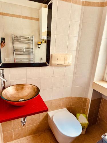 a bathroom with a sink and a toilet at Pang's Home in Marghera