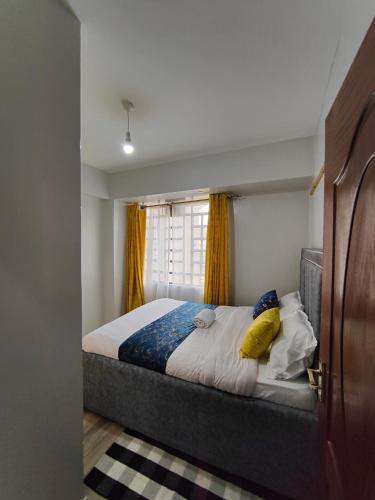 Ένα ή περισσότερα κρεβάτια σε δωμάτιο στο Tejj Home