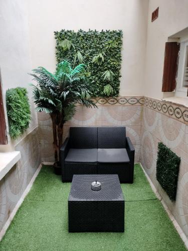 Appartement cosy avec patio en RDC