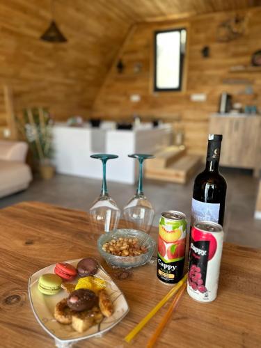 a table with a plate of food and a bottle of wine at Kandybos Eco Farm Village in Kas