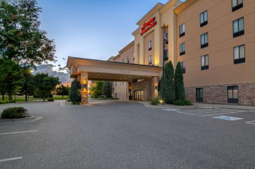 a hotel with a parking lot in front of it at Hampton Inn & Suites Billings West I-90 in Billings
