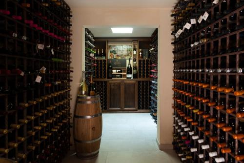 a room filled with lots of bottles of wine at Tenute Baglio Passofondo in Alcamo