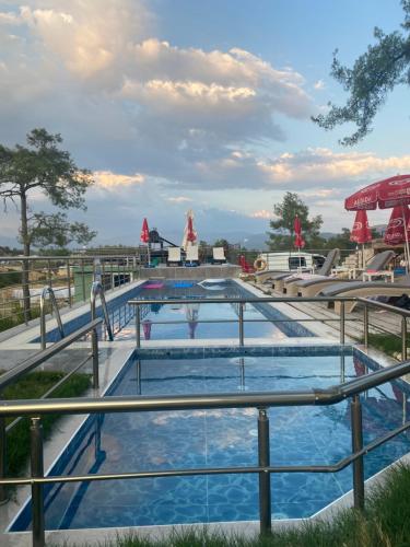 a group of three pools on a resort at Kandybos Eco Farm Village in Kas