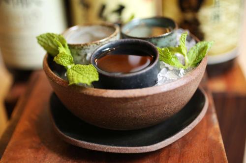 a brown bowl with a plant in it on a table at Grand Hyatt Rio de Janeiro in Rio de Janeiro