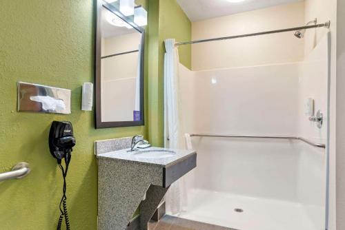 a bathroom with a sink and a shower at Sleep Inn & Suites Montgomery East I-85 in Montgomery
