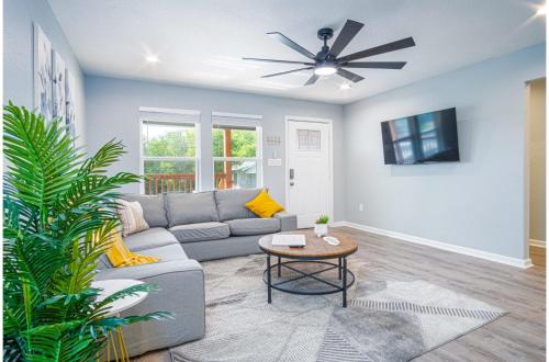 a living room with a couch and a ceiling fan at Comfortable 4BR2.5BA Family Home Near Riverwalk in San Antonio