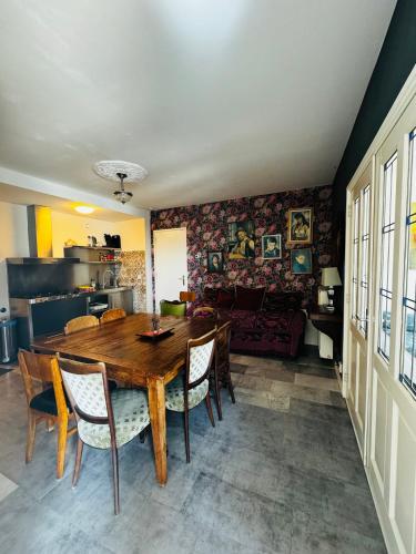 a dining room with a wooden table and chairs at Friend zone in Zaandam