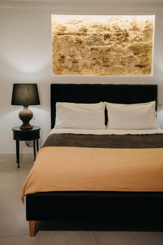 Letto o letti in una camera di Palazzo Natoli Boutique Hotel