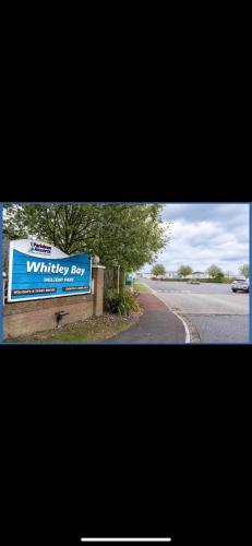 a sign for a wildlife box on the side of a road at Whitley Bay Caravan in Hartley