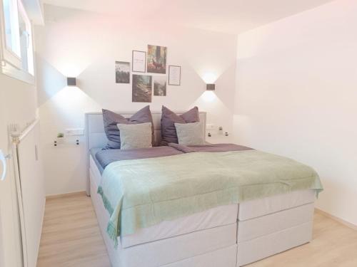 En eller flere senge i et værelse på Highlight Maisonette - 94 qm und bis zu 6 Personen!