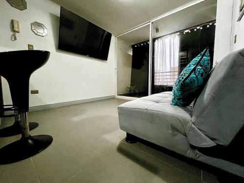 a living room with a couch and a window at Departamento 1 High Quality in Antofagasta