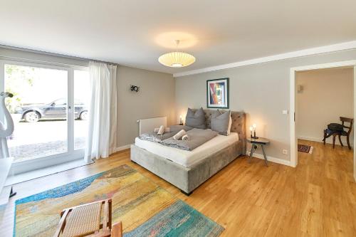a bedroom with a bed and a large window at Ferienwohnung Gudrun in Bernkastel-Kues