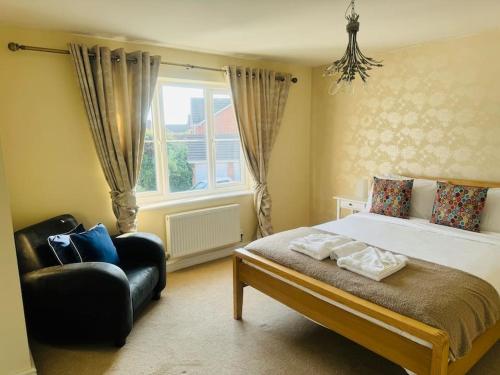 Ένα ή περισσότερα κρεβάτια σε δωμάτιο στο Detached 4 Bed Family Home