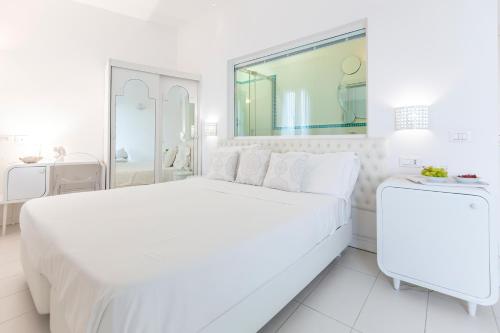 Ένα ή περισσότερα κρεβάτια σε δωμάτιο στο Hotel Al Cavallino Bianco