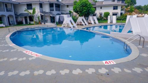 Bazén v ubytování Regenta Baywatch Resort, Goa nebo v jeho okolí