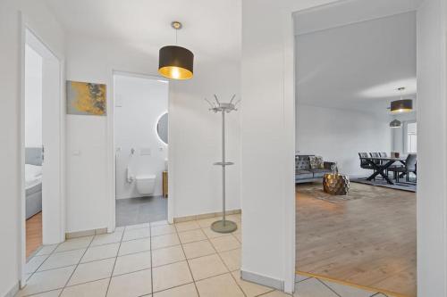 a living room with white walls and a glass door at 3 Zimmer EG Wohnung direkt am Kurpark in Bad Aibling