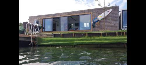 a house with a view of the water at Lakeside Wevelgem in Wevelgem