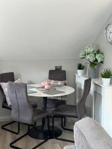 a dining room with a table and chairs at Old Farmhouse Annex in Clones