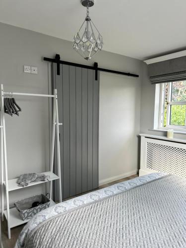 a bedroom with a large sliding door and a bed at Old Farmhouse Annex in Clones