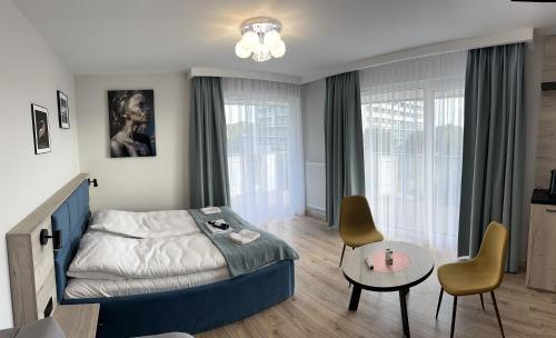 Postel nebo postele na pokoji v ubytování Apartament Lux Kasprowicza z basenem SPA Siłownia