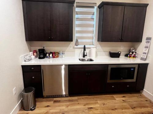 a kitchen with a sink and a counter top at Cozy Retreat facing Western Park in Tracy