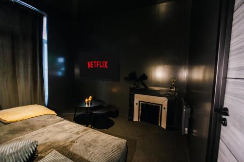 Katil atau katil-katil dalam bilik di Dreamy Room - Evasion, balnéo & cinéma privé