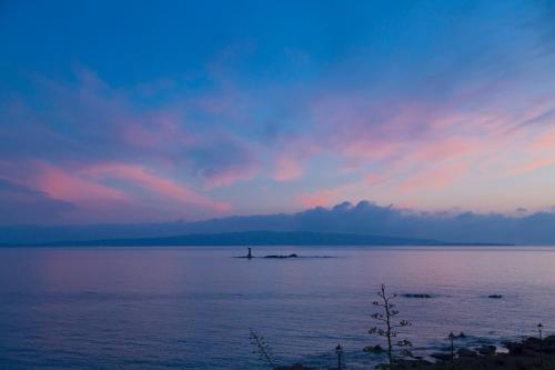 a person standing on a island in a large body of water at Relais La Ghinghetta in Portoscuso
