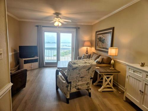 a living room with a couch and a table at Docks 12C in Pensacola