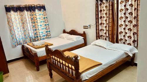 Postel nebo postele na pokoji v ubytování De villa Breeze Beach Inn