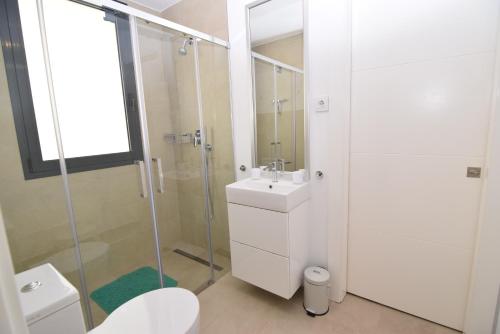 a bathroom with a shower and a sink and a toilet at Dream Gardens 2 in Mijas Costa