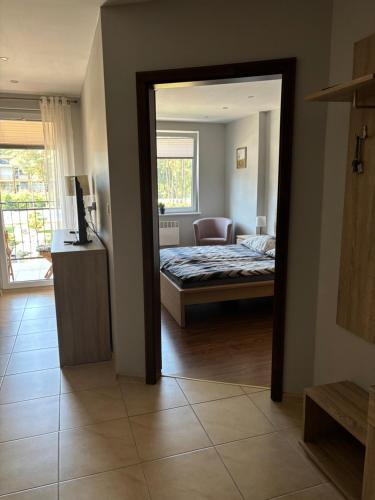 Postel nebo postele na pokoji v ubytování BLUE MARE Apartamenty MES