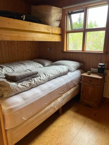 a bedroom with a bunk bed in a room at Cabin in Vaðnes in Selfoss