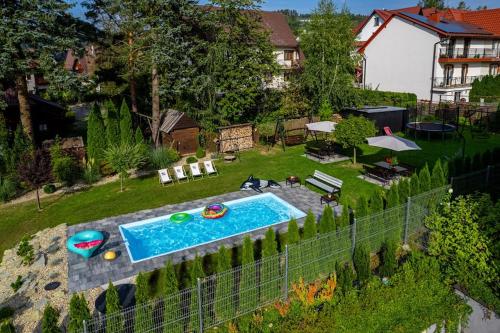 an aerial view of a backyard with a swimming pool at Noclegi u Nawary in Rabka