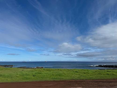 a view of the ocean under a cloudy sky at Cabañas Anavai Rapa Nui in Hanga Roa