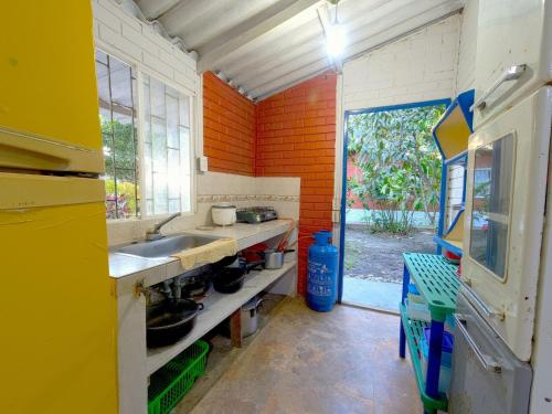 a kitchen with a sink and a counter top at Las Cabañas de Mario in Necoclí