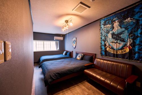 a room with two beds and a couch at Harry Potter Osaka HogwartsSchool哈利波特 魔法学院 in Osaka