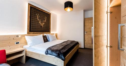 Ένα ή περισσότερα κρεβάτια σε δωμάτιο στο Apartments Rainer - Val Gardena