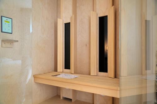 a window shelf in a bathroom with two windows at Parc Hotel Flora S in Riva del Garda