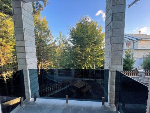 a view of a pool from a house at Vila Alpini in Razëm