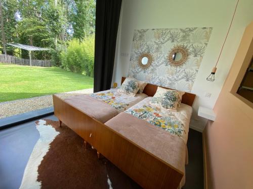 Postel nebo postele na pokoji v ubytování Sittelles lodges cube