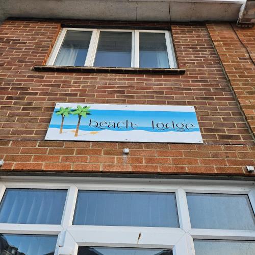 a sign on the side of a brick building at Beach Lodge in Shanklin