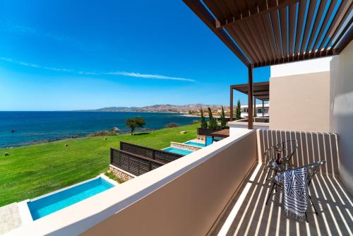 a view of the ocean from the balcony of a house at Al Mare Villas in Kiotari