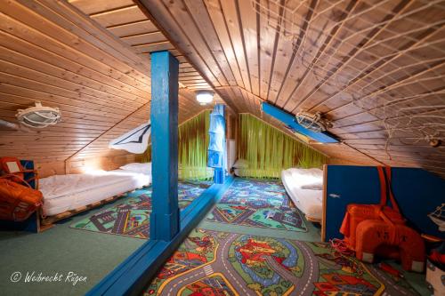 a room with two bunk beds and a rug at Ferienhaus Luppath in Poseritz