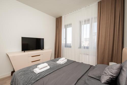 Ένα ή περισσότερα κρεβάτια σε δωμάτιο στο Belgrade Waterfront Apartments - Libera