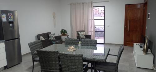 a kitchen and dining room with a table and chairs at Tity Apartments T2- Santa Maria in Santa Maria