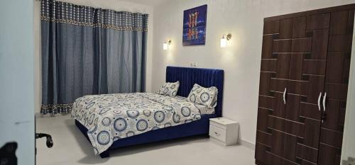 Ένα ή περισσότερα κρεβάτια σε δωμάτιο στο Kamf immo