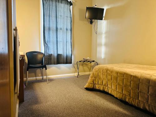Postel nebo postele na pokoji v ubytování Merrylees Hotel