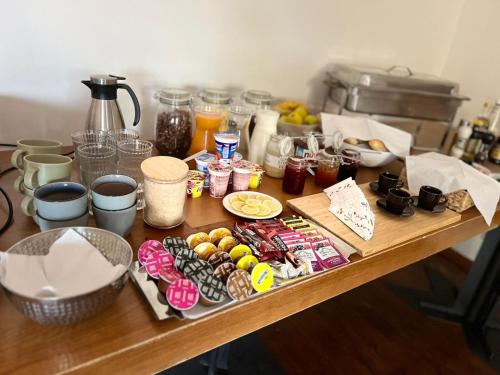 a wooden table with food and drinks on it at B&B Vltavín in Zduchovice